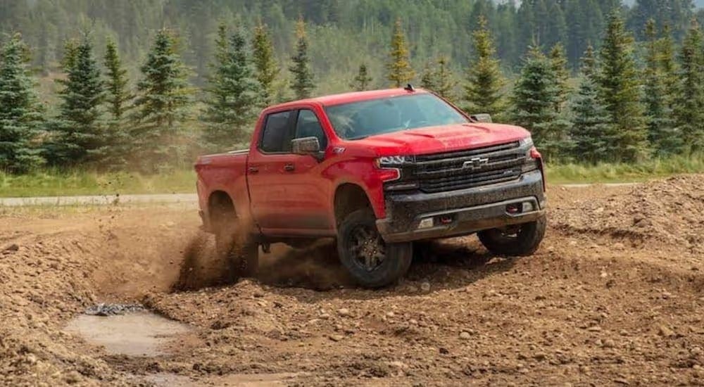 A red 2020 Chevy Silverado 1500 Trail Boss is shown from the front.