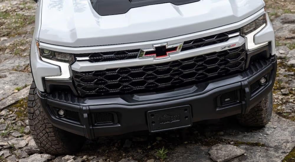 A close up of the front of a white 2023 Chevy Silverado ZR2 Bison for sale is shown near Middletown, PA.